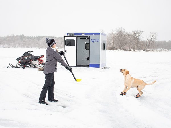 stryker ice house woman with dog