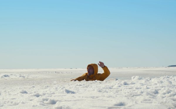 Man fell through ice and drowning in water icy winter frosty day