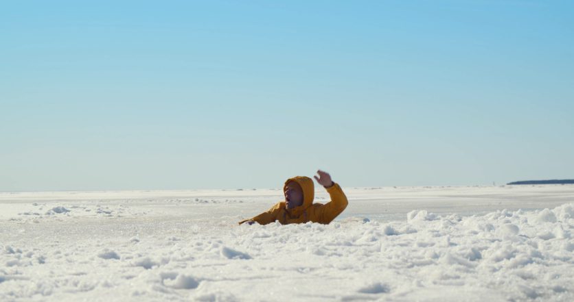 person in water after falling through ice