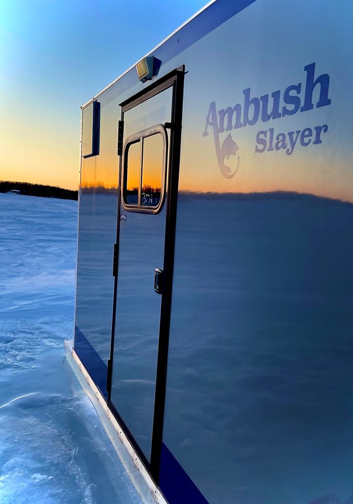 Slayer skid house with sunset reflected on it
