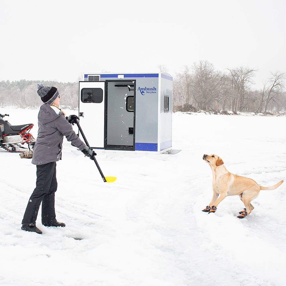 stryker ice house woman with dog