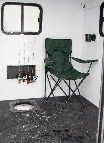 stryker skid ice house interior with lawn chair next to ice hole on floor